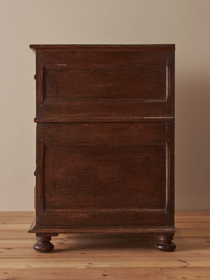 A George I oak chest of drawers on bun feet