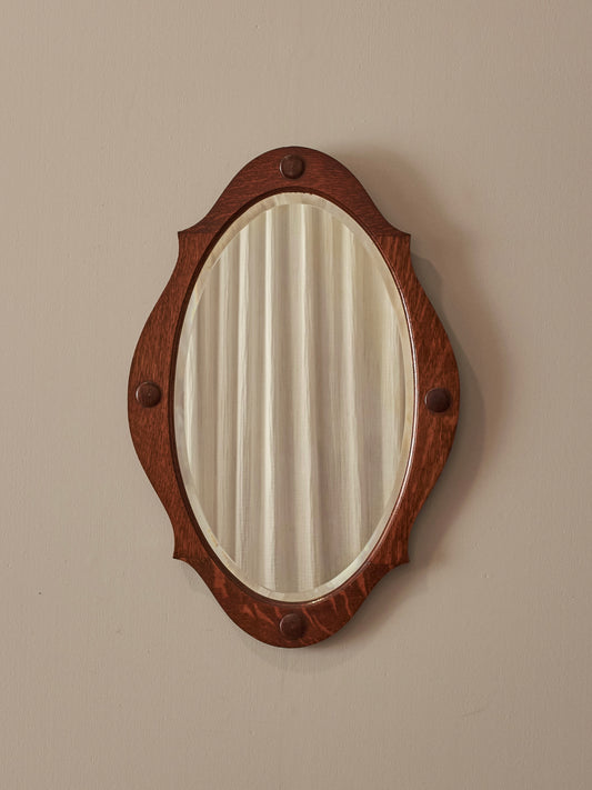 Arts and Crafts oval bevelled mirror