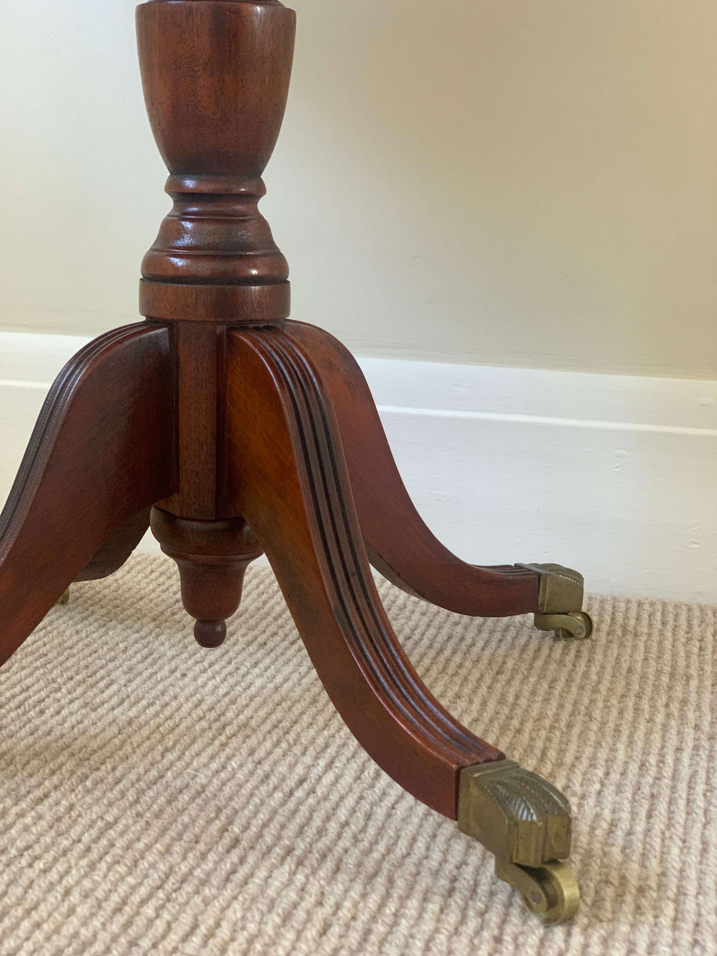 Vintage oval occasional table with brass claw feet