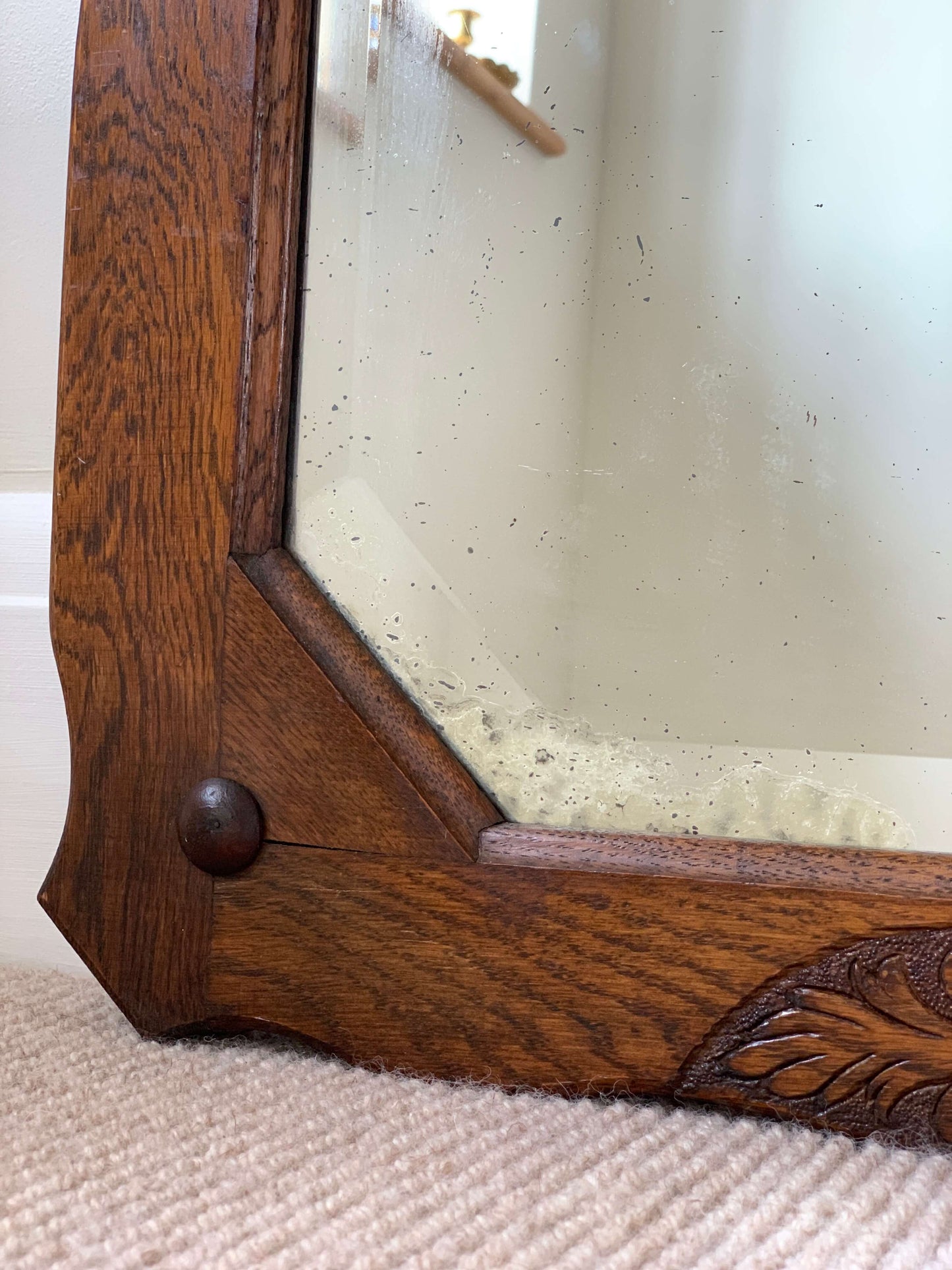 Antique oak-framed bevelled mirror