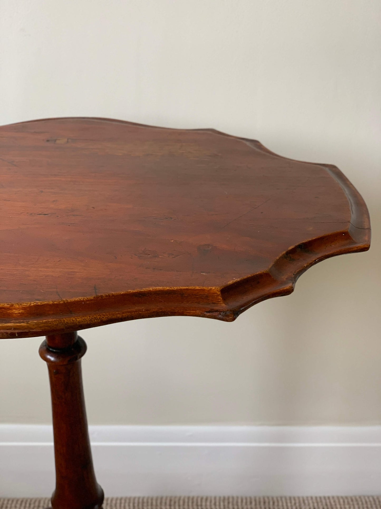 Antique scallop-edged occasional table on splayed legs