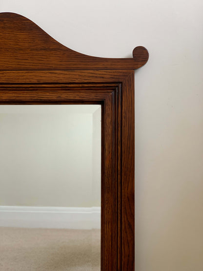 Antique oak framed bevelled mirror with scallop detail