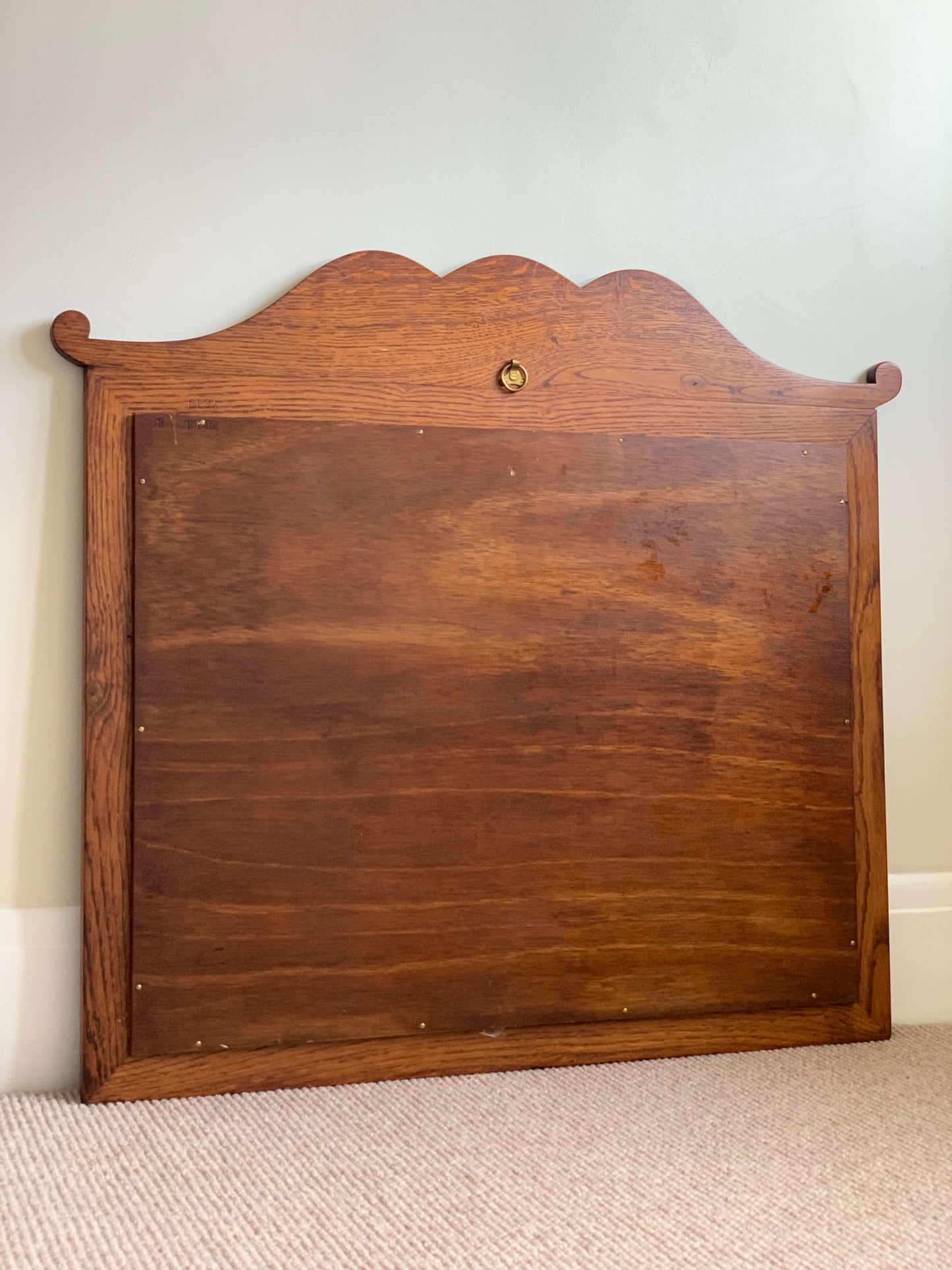 Antique oak framed bevelled mirror with scallop detail