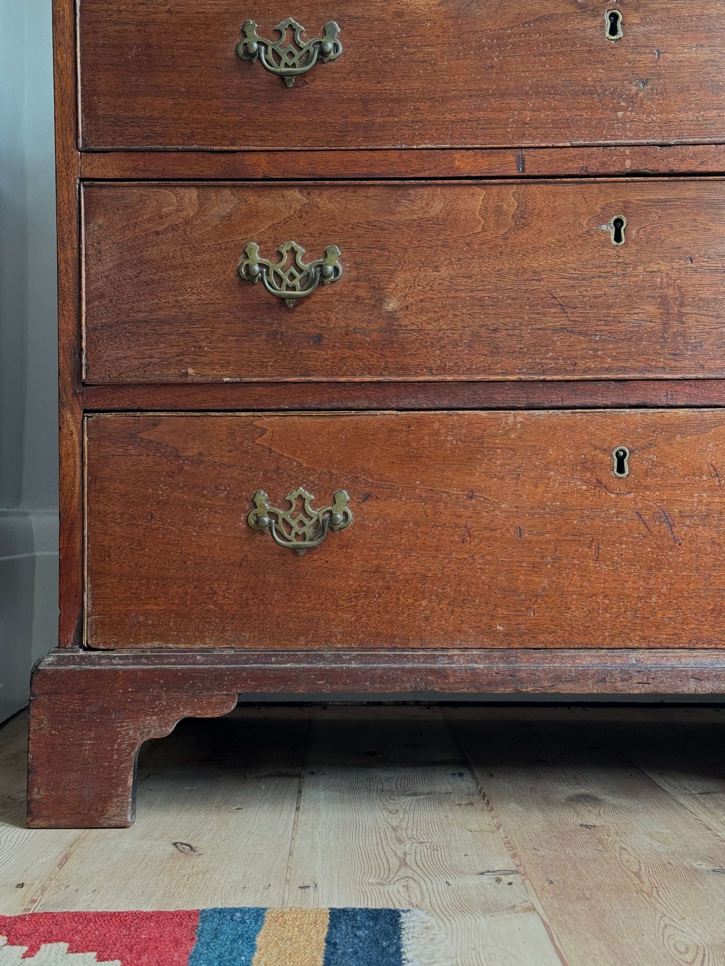 Georgian oak chest of drawers on bracket feet