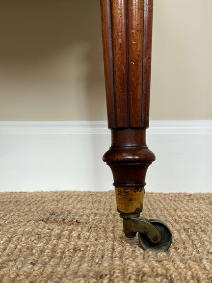 Victorian writing desk on brass castors