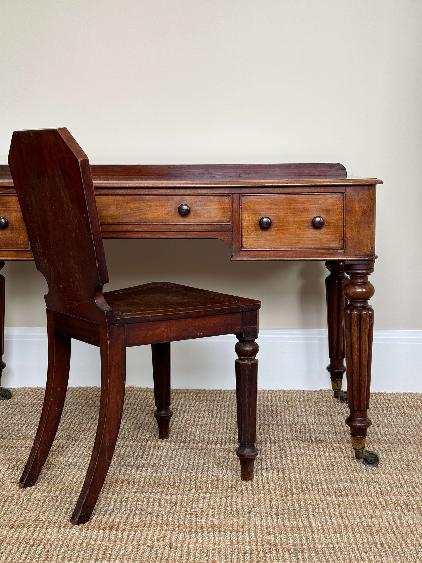 Victorian writing desk on brass castors