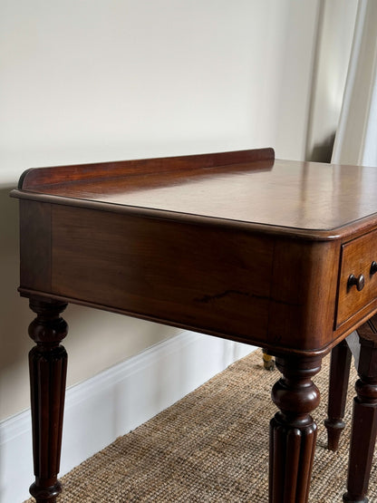 Victorian writing desk on brass castors