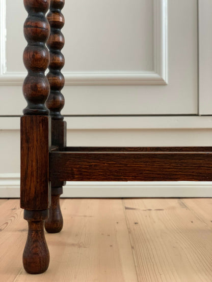 Antique oak table with scalloped edges and bobbin legs