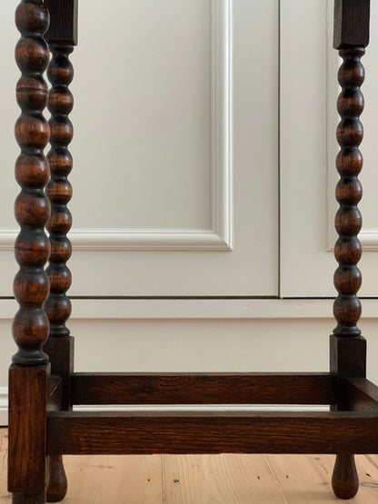 Antique oak table with scalloped edges and bobbin legs