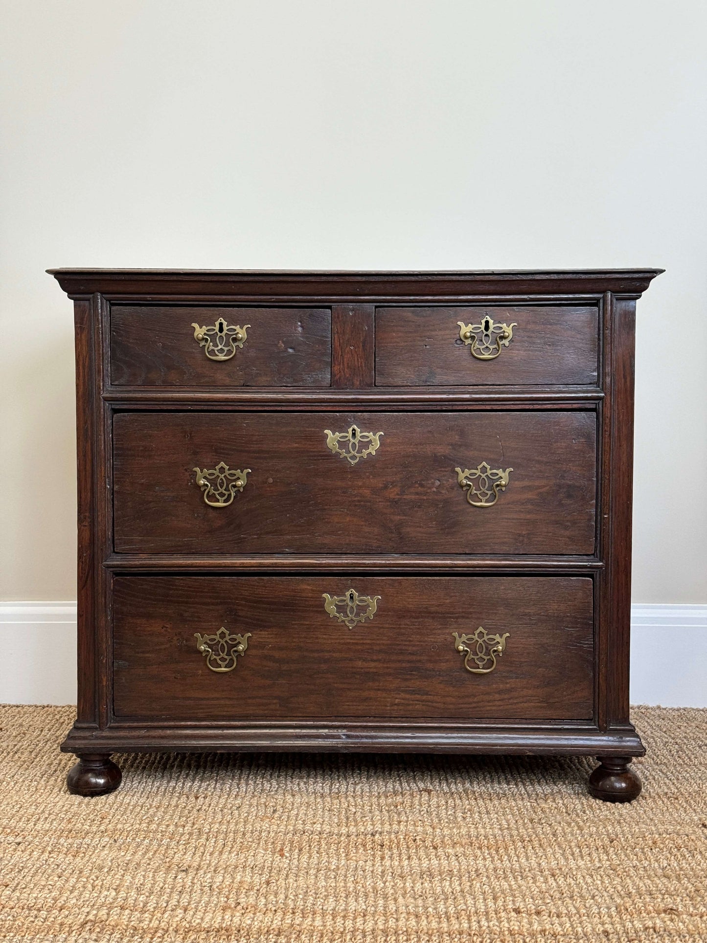 William and Mary oak chest of drawers on bun feet