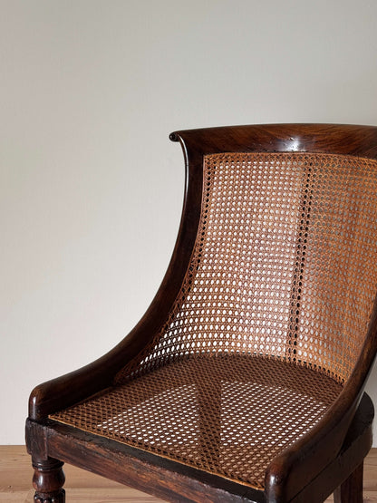Regency caned bergère chair on fluted legs