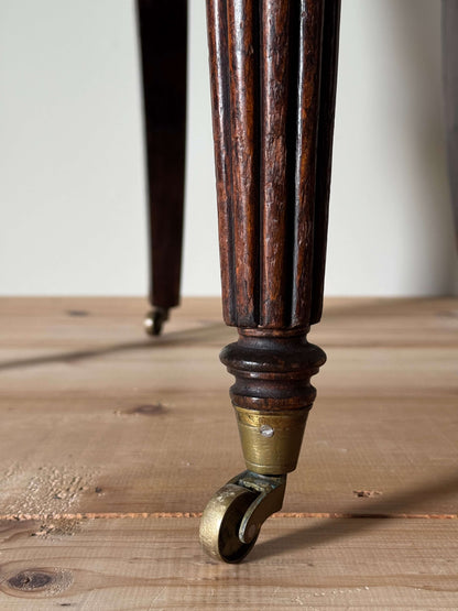 Regency caned bergère chair on fluted legs