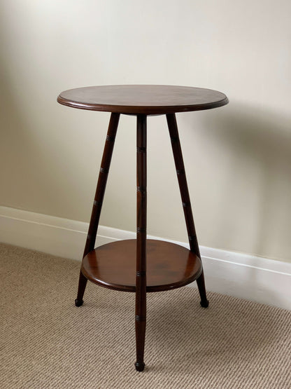 Circular antique cricket table with turned legs