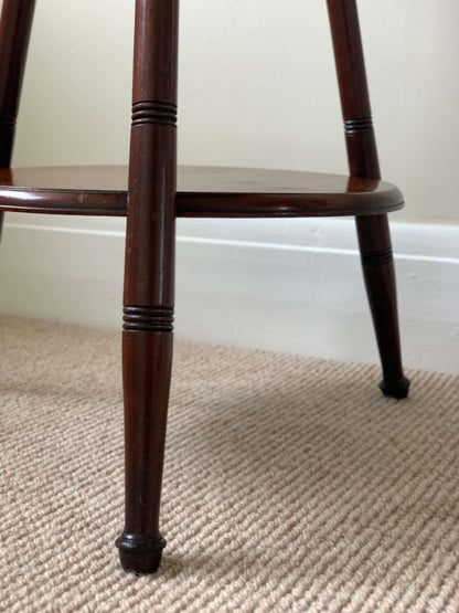 Circular antique cricket table with turned legs