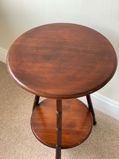 Circular antique cricket table with turned legs