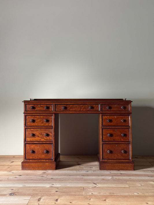 Regency mahogany fiddleback twin pedestal desk
