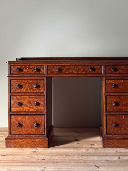 Regency mahogany fiddleback twin pedestal desk