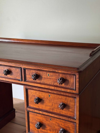 Regency mahogany fiddleback twin pedestal desk