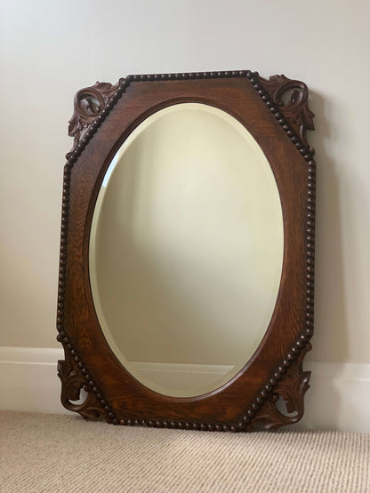 Antique bevelled mirror with carved corners