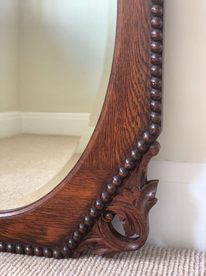 Antique bevelled mirror with carved corners