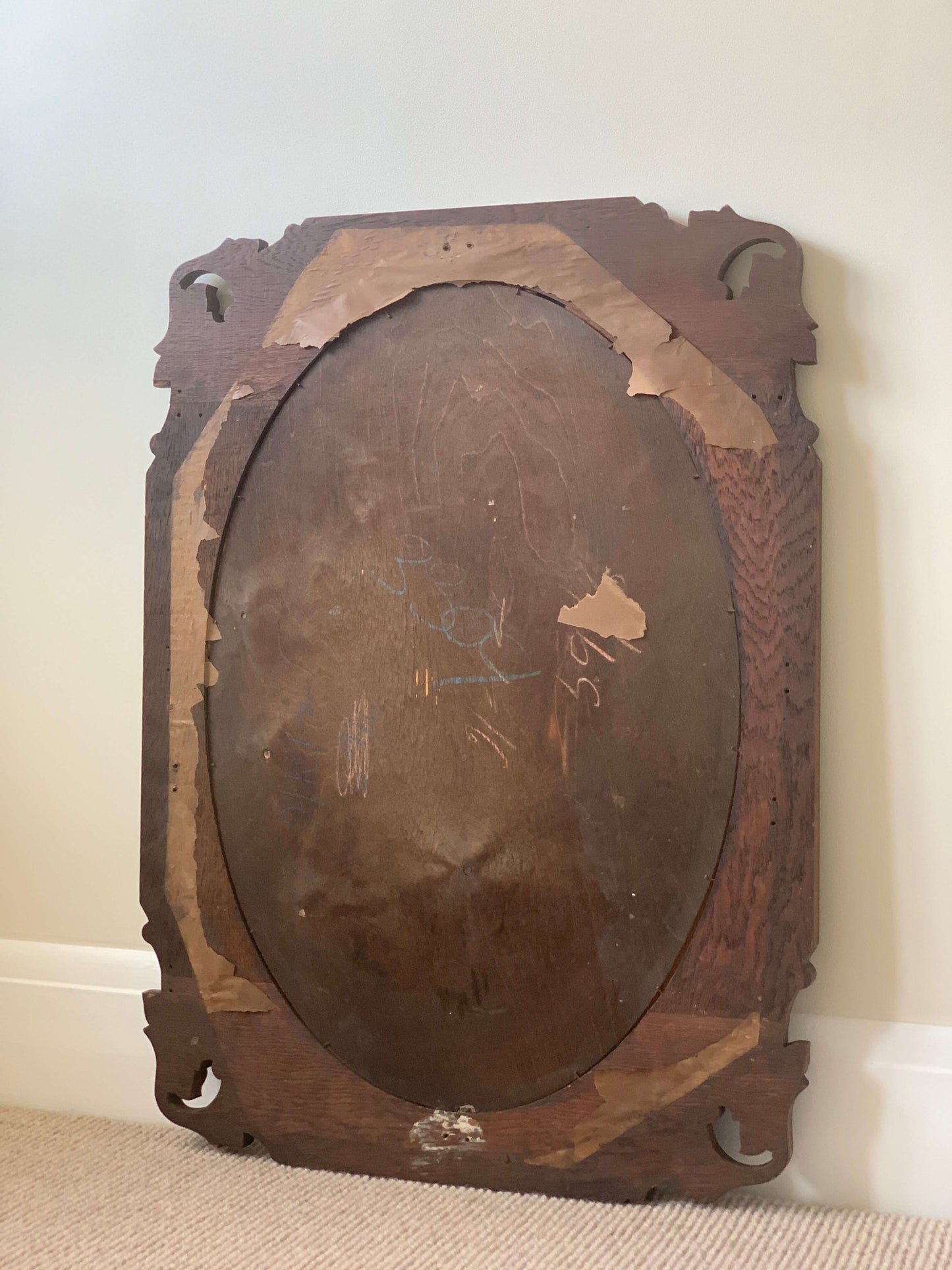 Antique bevelled mirror with carved corners