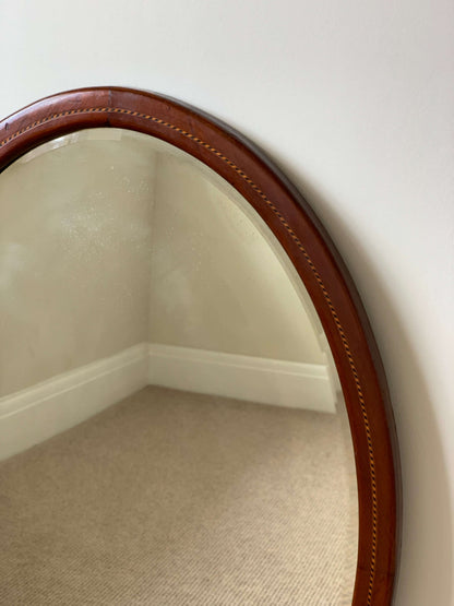 Antique oval mirror with marquetry detail