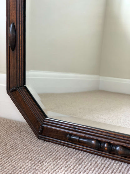 Antique octagonal bevelled mirror with beaded frame