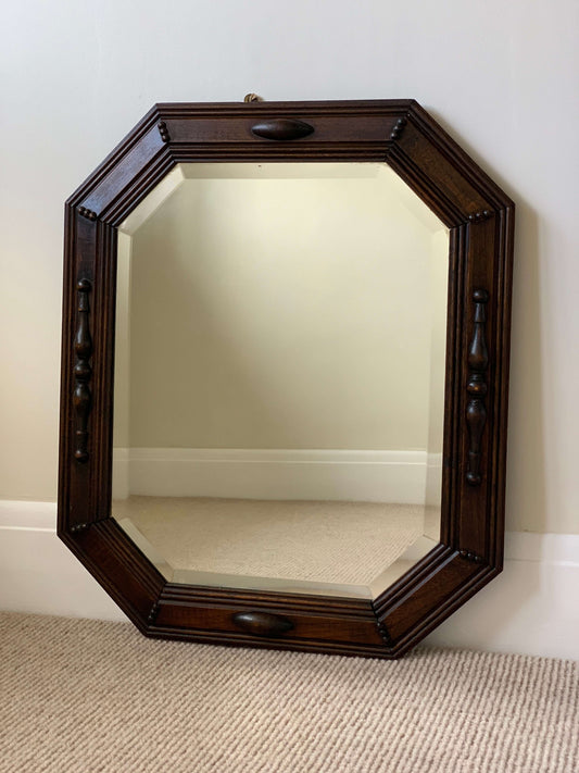 Antique octagonal bevelled mirror with beaded frame