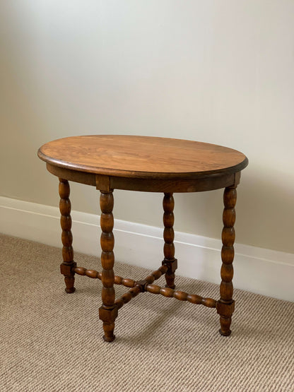 Blonde antique oval bobbin table