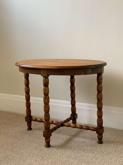 Blonde antique oval bobbin table