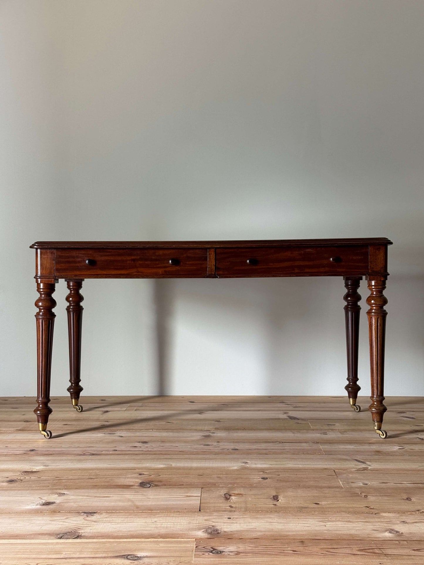 Victorian mahogany desk on brass castors