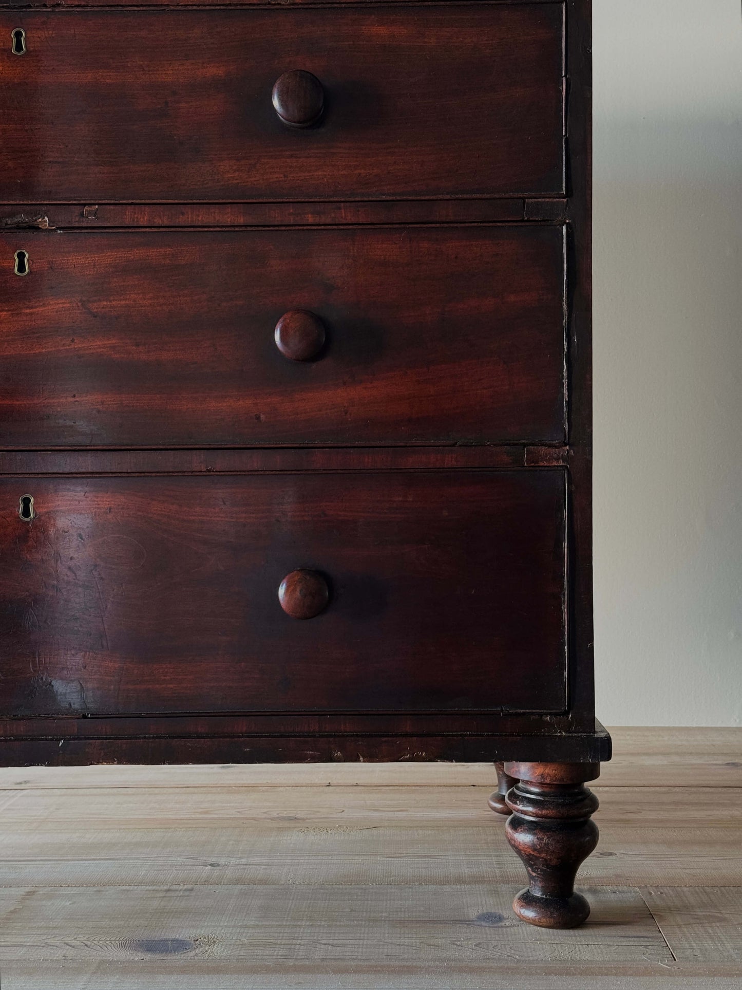 Regency mahogany chest of drawers on bun feet