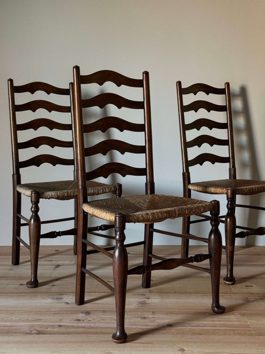 Set of four antique beech ladder back dining chairs