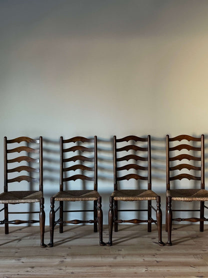 Set of four antique beech ladder back dining chairs