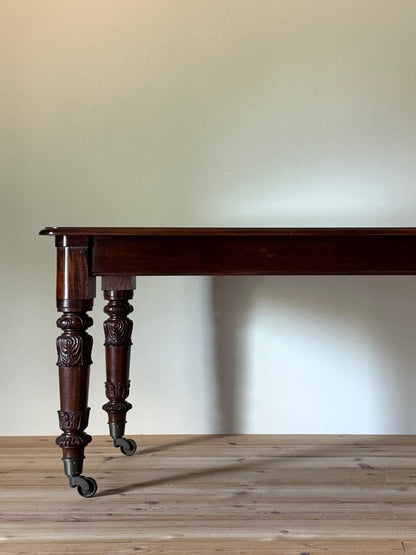 William IV mahogany dining table on brass castors