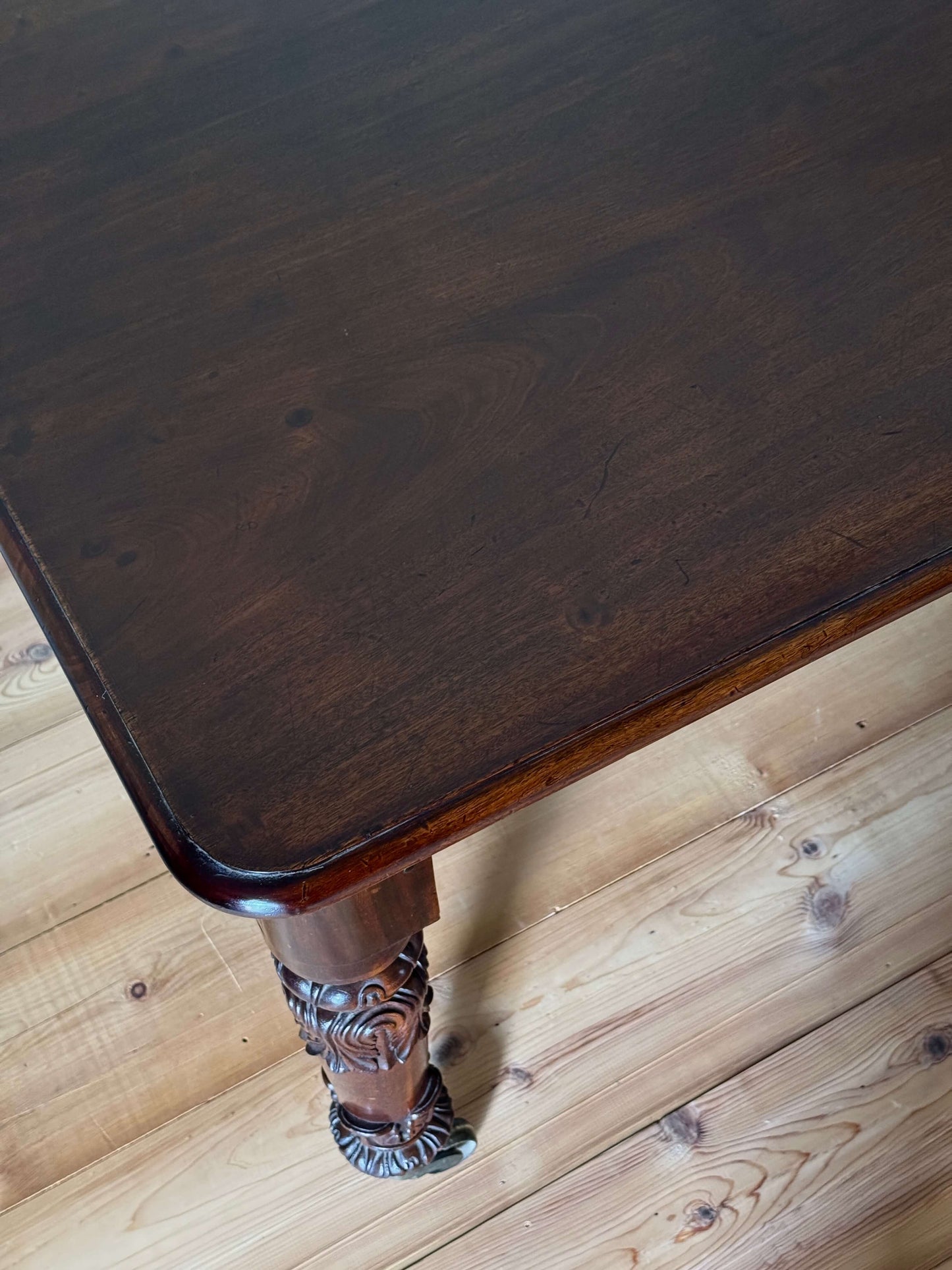 William IV mahogany dining table on brass castors