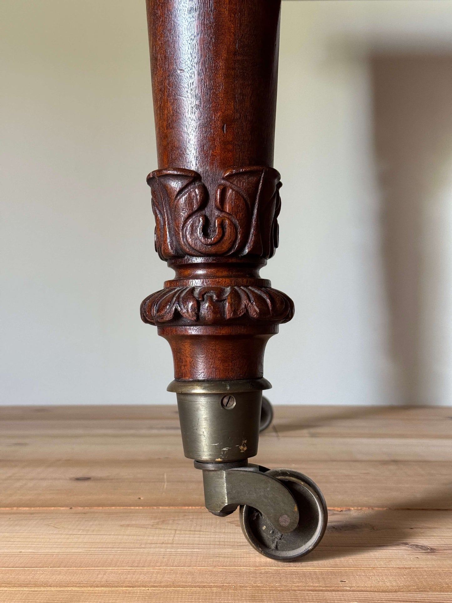 William IV mahogany dining table on brass castors