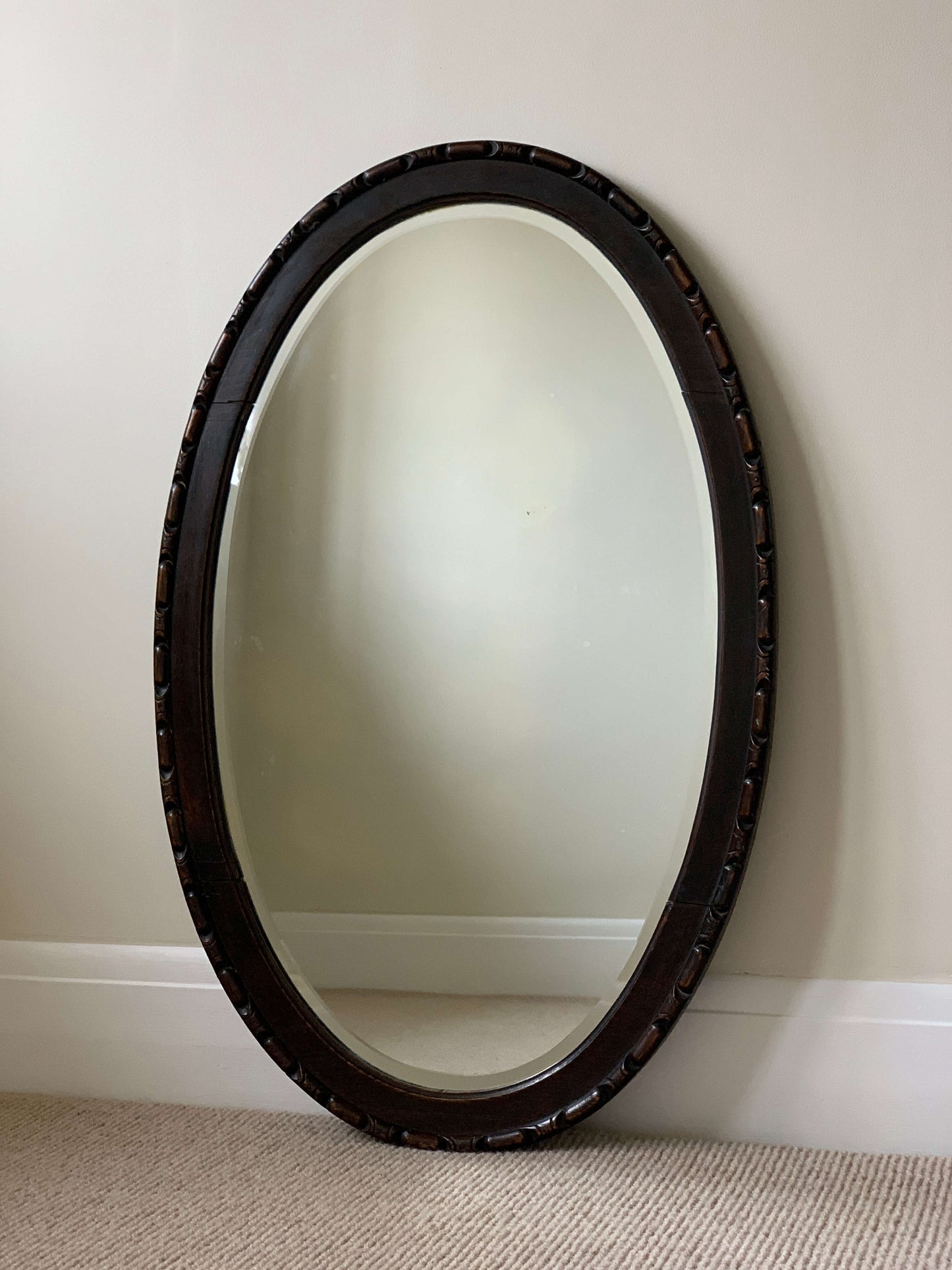 Victorian antique hand-carved oval mirror