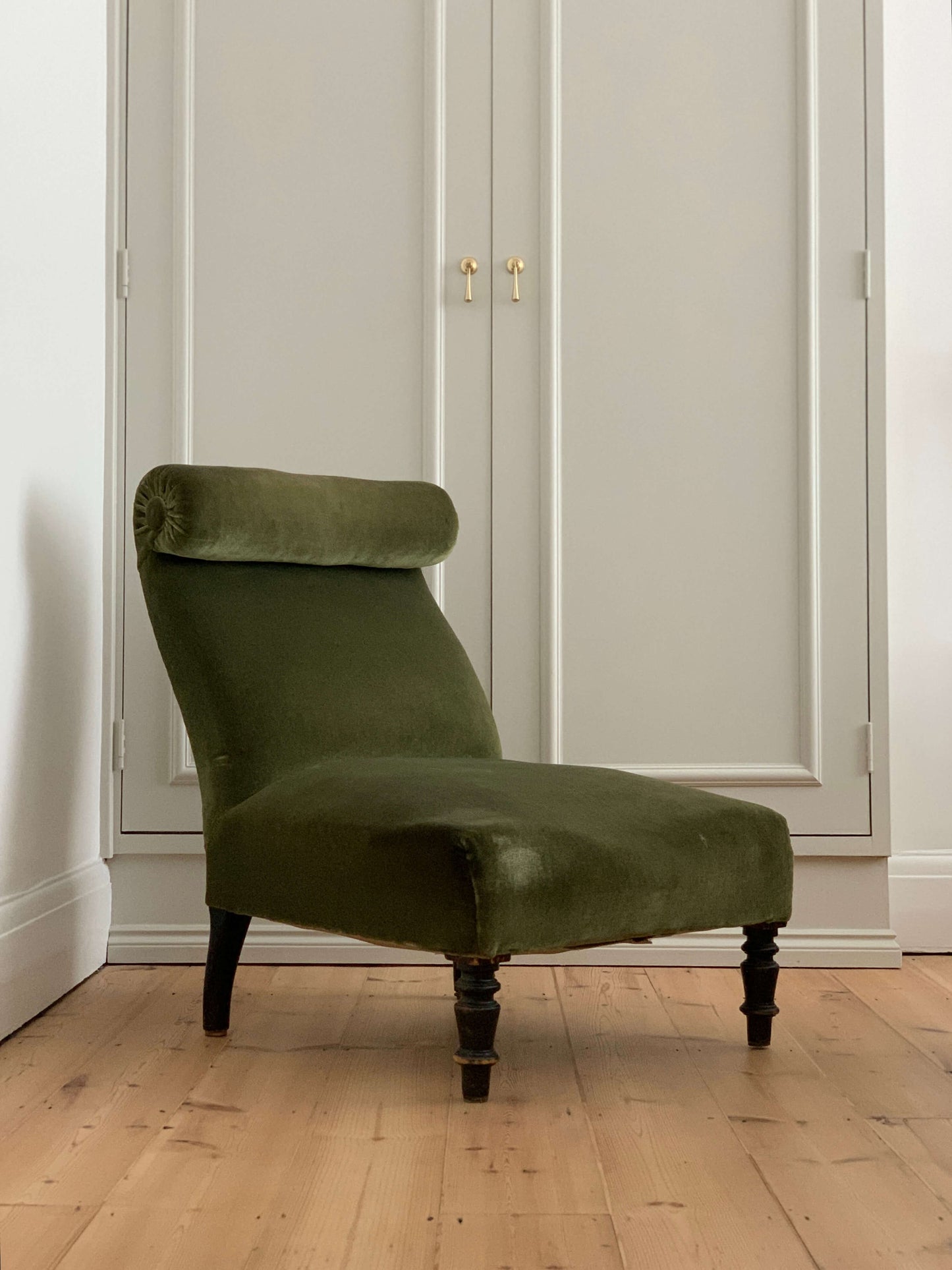 French antique green armchair with scroll top