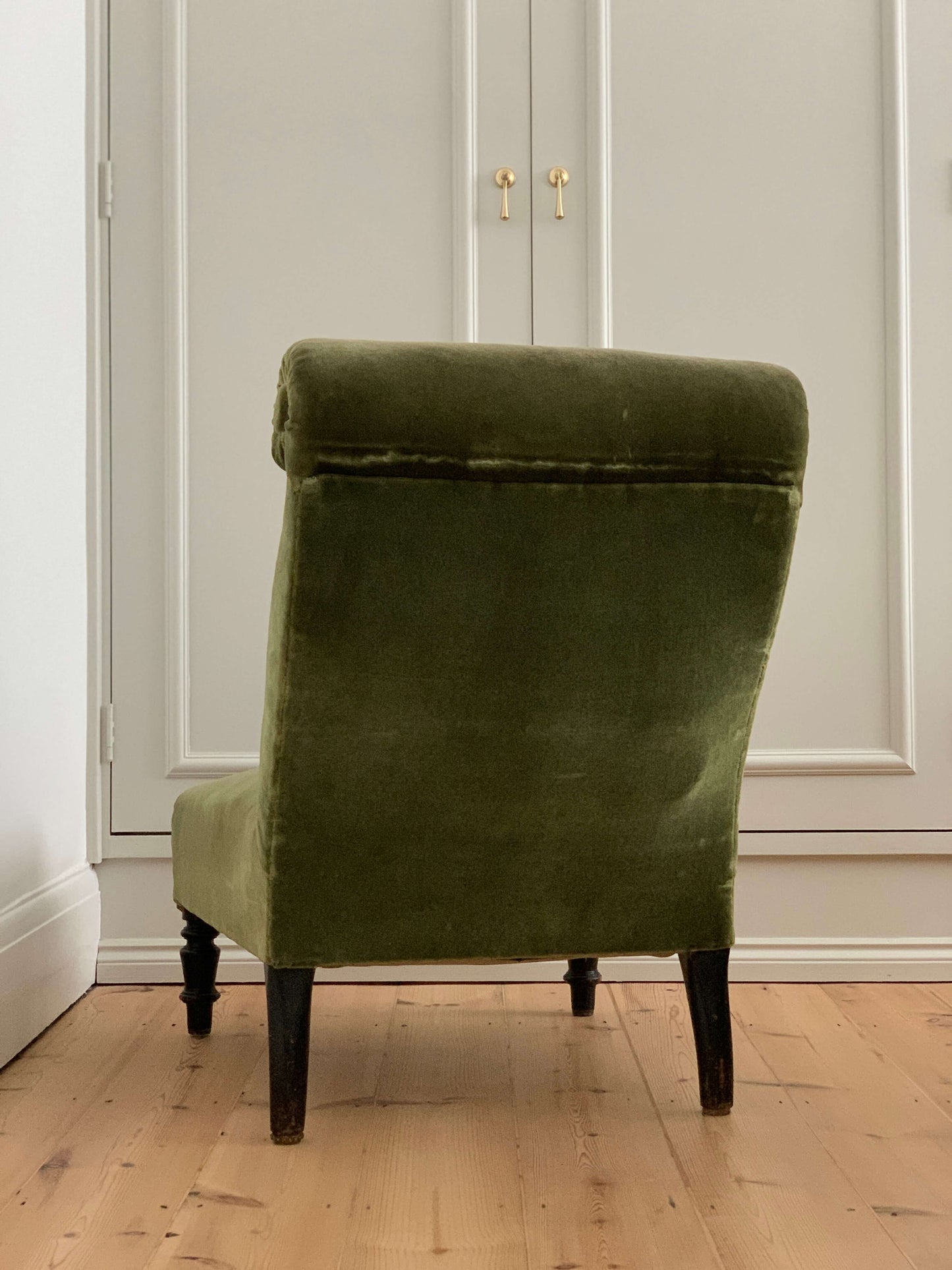 French antique green armchair with scroll top