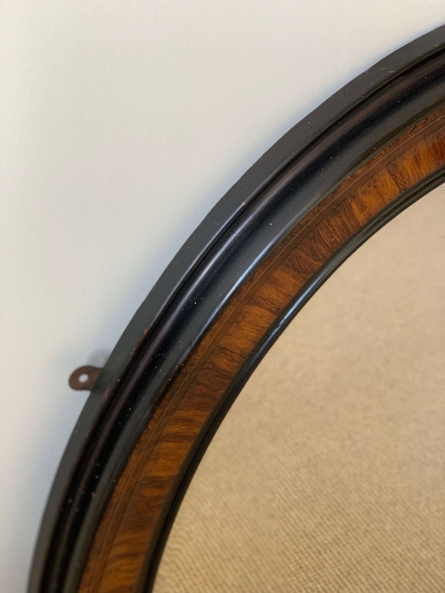 Edwardian oval veneered bevelled mirror