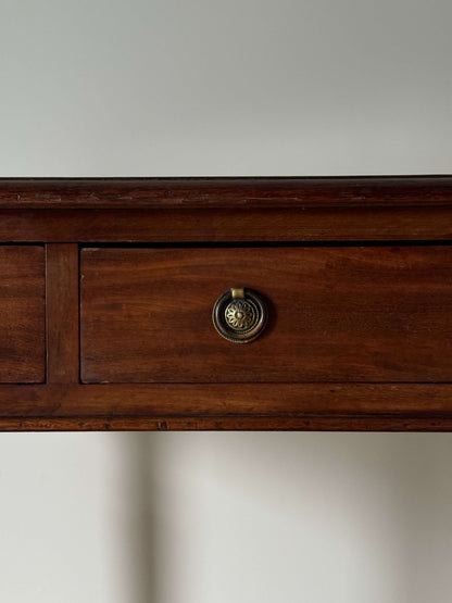 Regency mahogany writing desk on fluted legs and brass casters