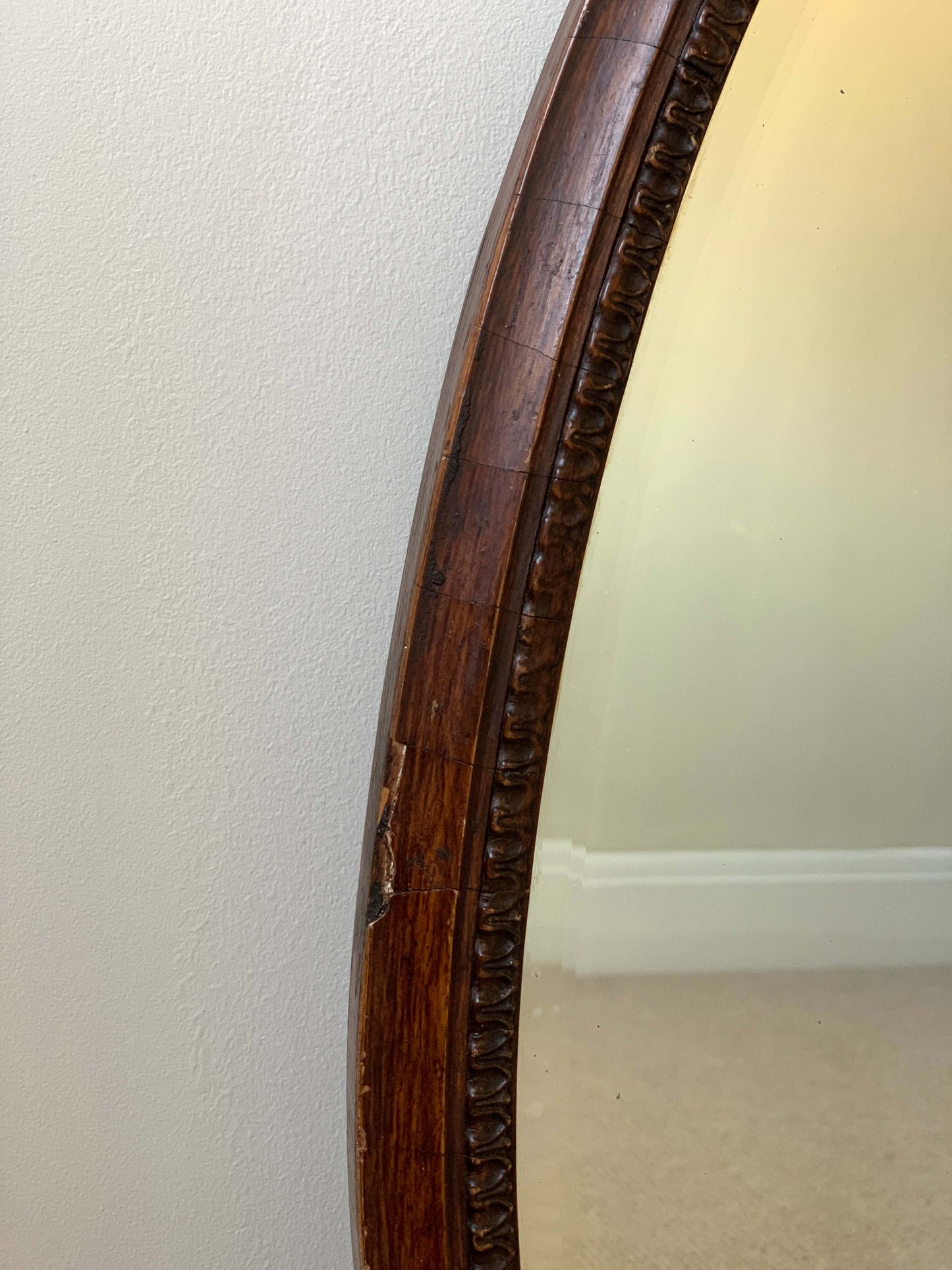 Antique late Victorian oval bevelled mirror