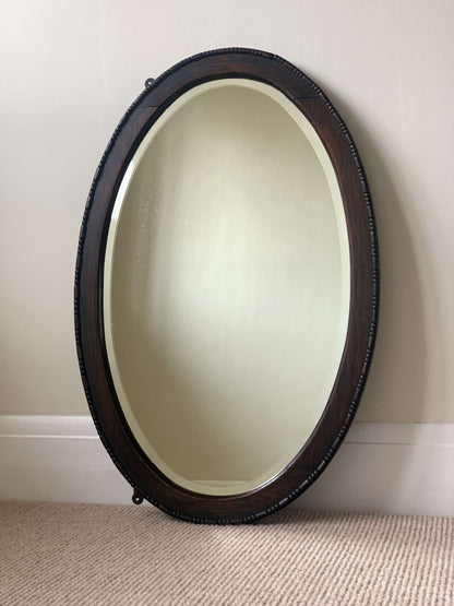 Antique dark oak bobbin detailed oval bevelled mirror