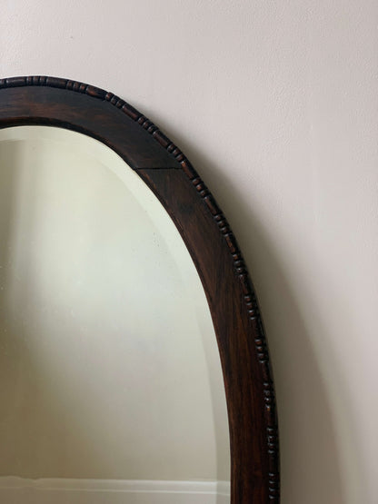 Antique dark oak bobbin detailed oval bevelled mirror