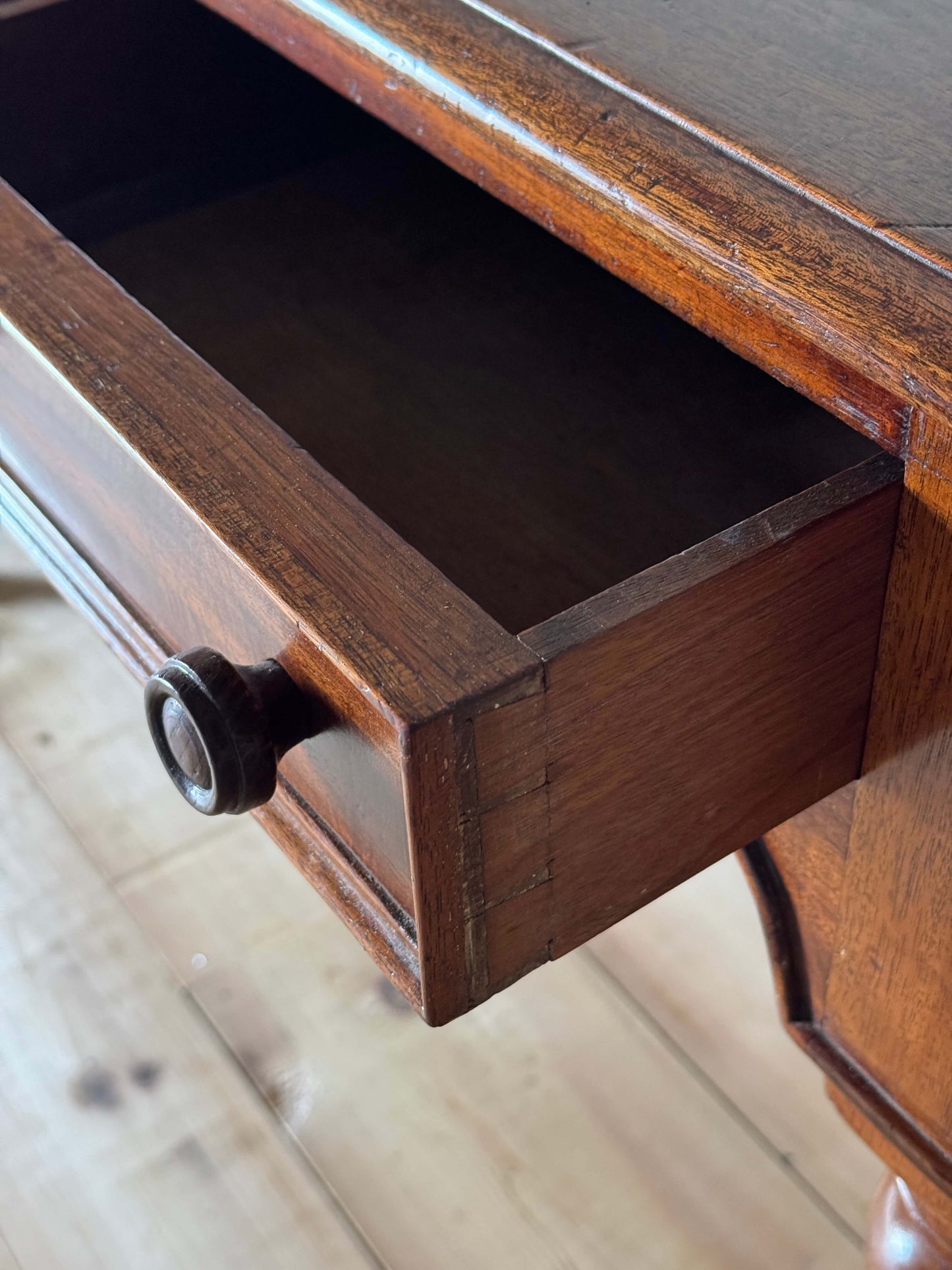 Antique Victorian mahogany writing desk on brass casters