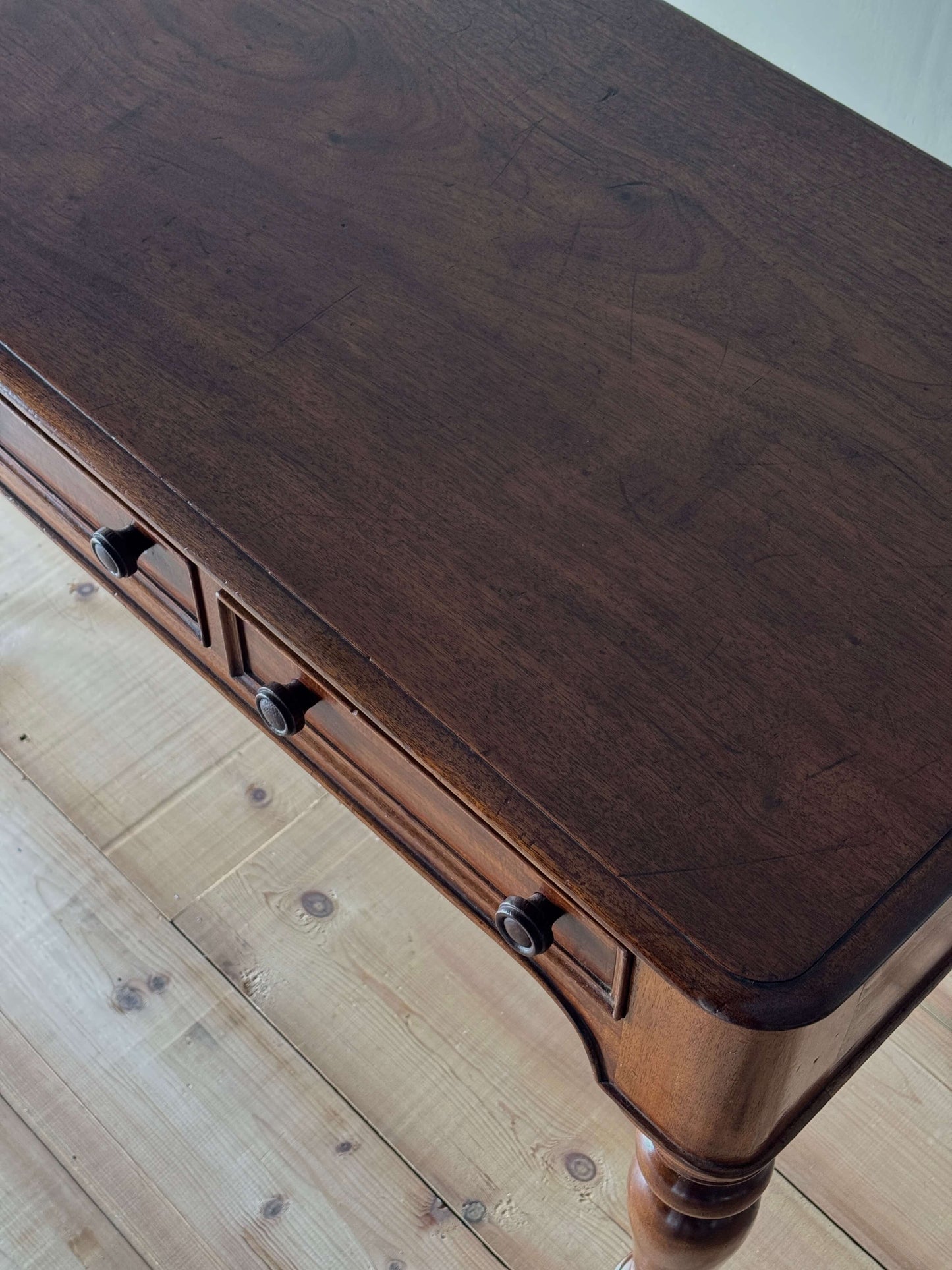 Antique Victorian mahogany writing desk on brass casters