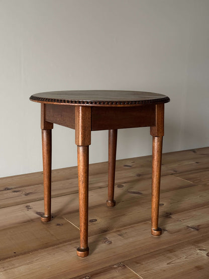 Vintage circular table with bobbin detailing