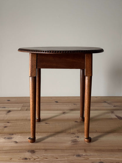 Vintage circular table with bobbin detailing