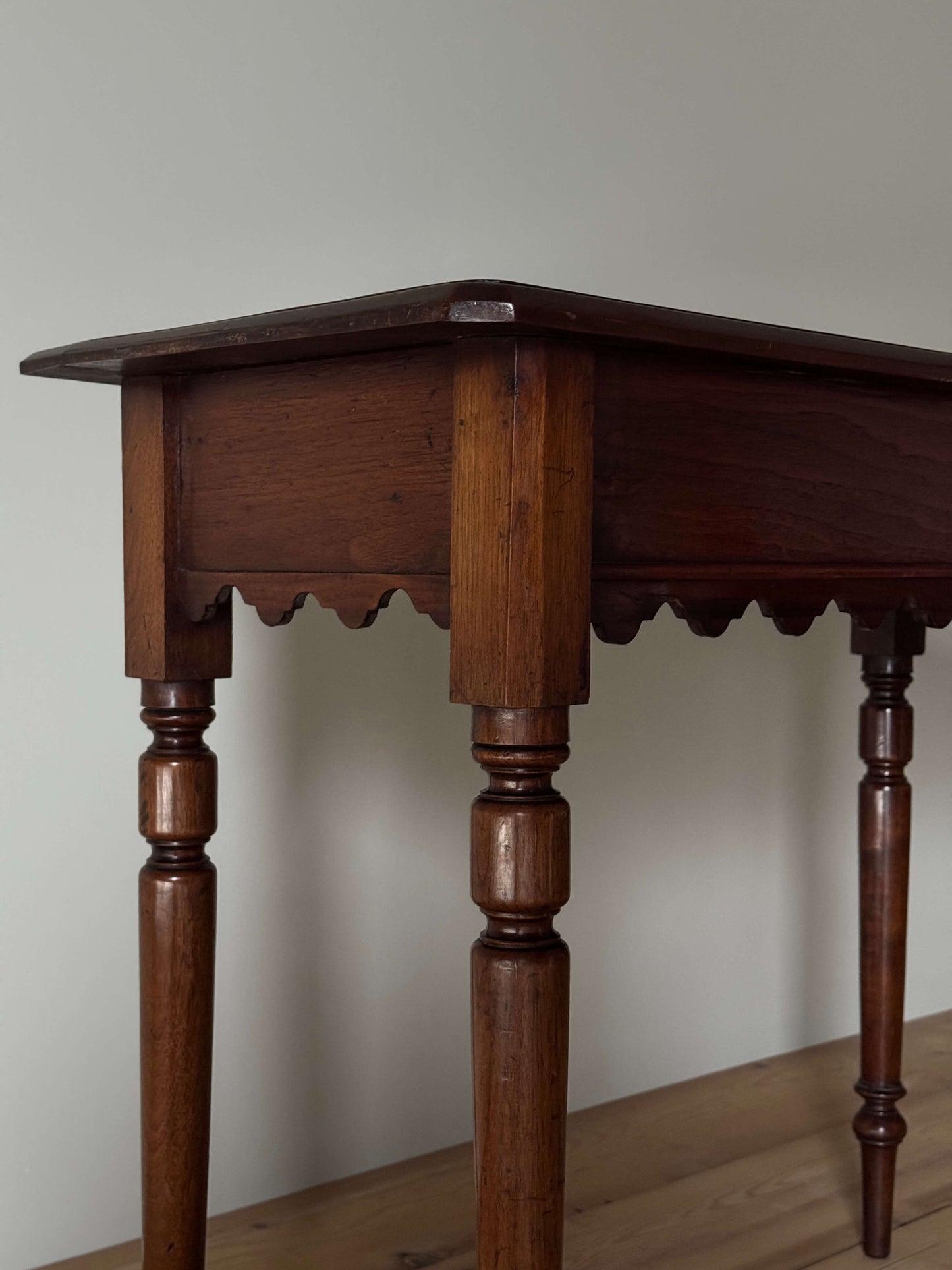 Antique walnut scalloped console table with drawer